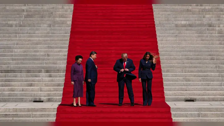 11 minutes on the steps: How an AP photographer framed Trump and Xi’s red-carpet shot