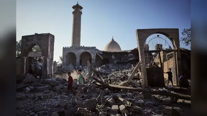 A damaged building collapses in Gaza, killing at least 12 people and other Mideast developments