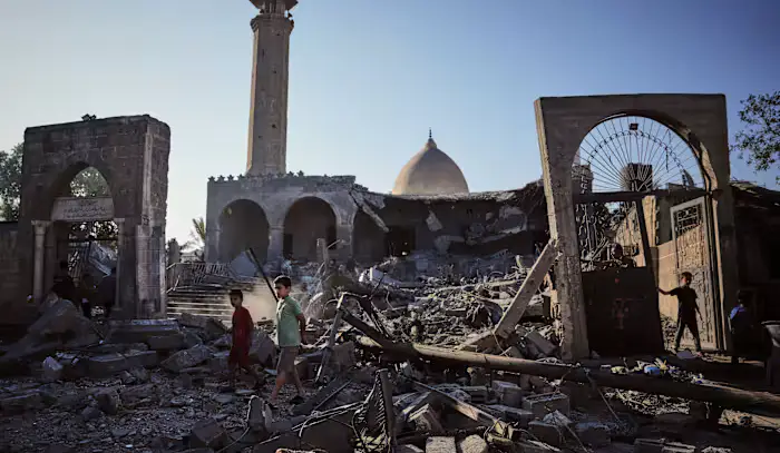 A damaged building collapses in Gaza, killing at least 12 people and other Mideast developments