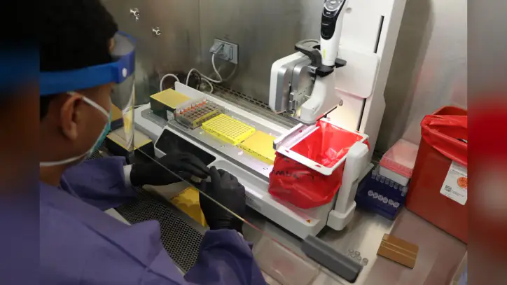 A laboratory technician at the Synthetic Biology and Biosurveillance Branch at the U.S. Army Medical Research Institute of Infectious Diseases demonstrates the Biodefense Mass Sequencing and Surveillance assay, developed by a team of researchers under the direction of branch chief Lt. Col. Jeffrey Kugelman during the coronavirus pandemic as a way to rapidly test large numbers of Service Members for exposure to COVID-19. BMASS can be used to test for multiple diseases at the same time, extending its potential beyond just COVID-19 surveillance. (DOD photo by: Paul Lagasse)