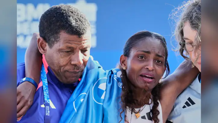 Cramps derail Tigst Assefa's world record as Guye Adola wins Berlin Marathon