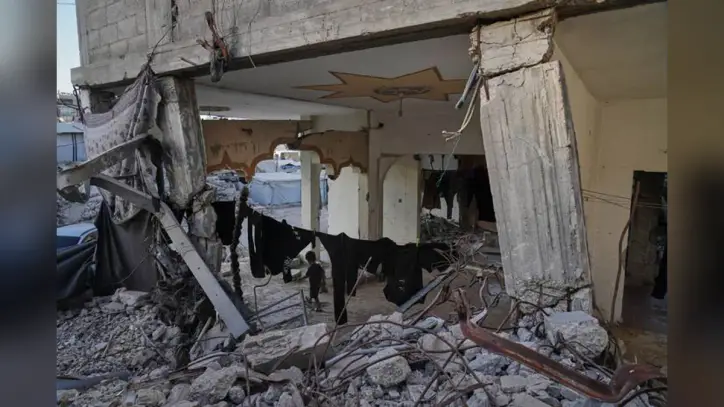 Fatal building collapse highlights dangers plaguing Gaza nearly a year after ceasefire