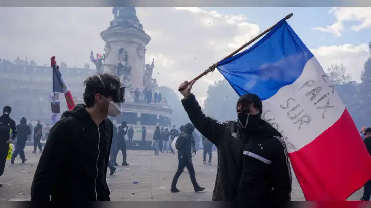 Clashes and fires break out as protesters rally across France, joining students