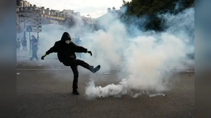 French riot police fire tear gas as more than 250,000 rally nationwide for school funding
