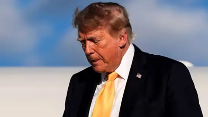US President Donald Trump disembarks Air Force One at Morristown Airport in Morristown, New Jersey. (AP Photo)
