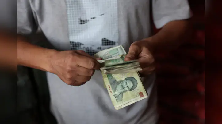 Iran's currency hits a new record low as war erodes the country's economic stability