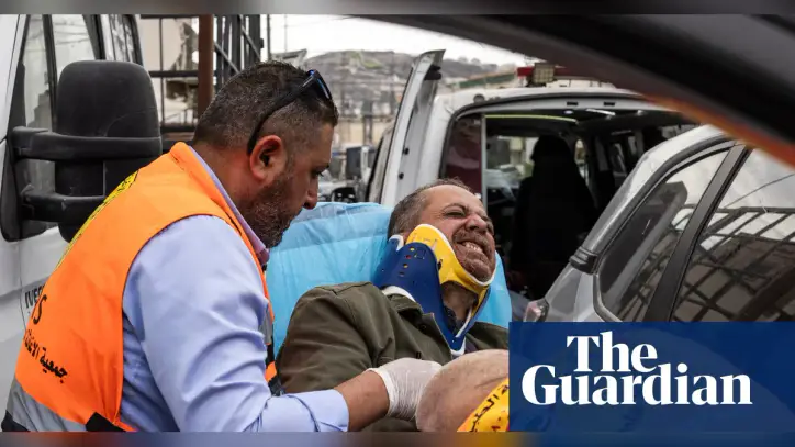 Israeli settlers beat press photographer as soldiers watch in West Bank