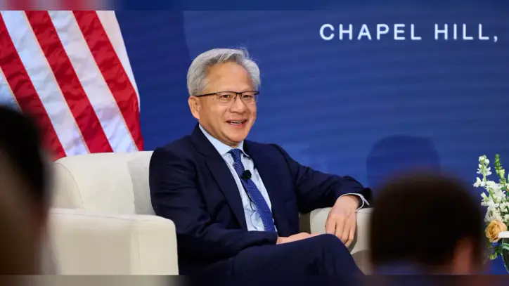 Jensen Huang puts Trump on speakerphone onstage to announce robots won’t take over the world