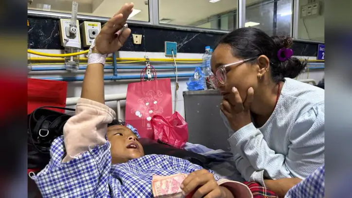 Mother Reunited With 8-Year-Old Who Climbed Trees to Survive Nepal Floods