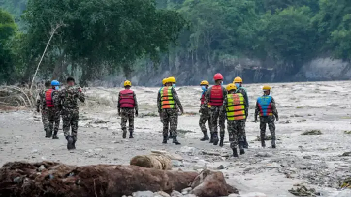 Nepal floods LIVE: Nepal Army personnel conduct a search and rescue operation along side a river area at Charaudi, in Dhading district, Nepal, Friday, Friday, Aug. 28, 2026.