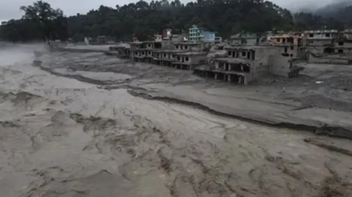 A drone view of the Trishuli river flowing past damaged buildings covered in mud after the deadly flash floods and mudslide, at Devighat, Nuwakot district, Nepal (REUTERS)