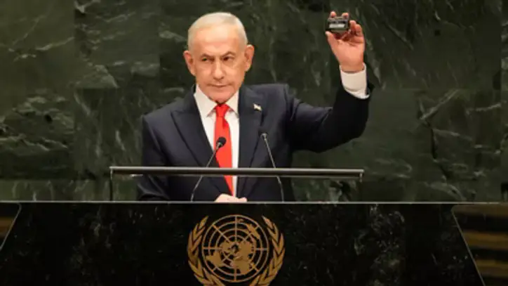 Israeli Prime Minister Benjamin Netanyahu holds a device as he speaks speaks during the 81st session of the United Nations General Assembly at United Nations headquarters. (AP)