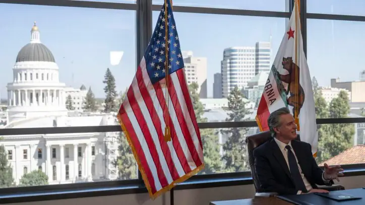 Gov. Gavin Newsom speaks to reporters during a bill signing at the Swing Space in Sacramento on Wednesday, Sept. 30, 2026. Newsom vetoed a bill that would have placed limits on the use of artificial intelligence in therapy.