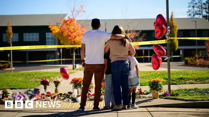 Oregon teacher fought school attacker before armed dad killed suspect
