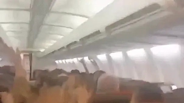 Plane passengers scream in harrowing mid-flight video as violent shaking sends cabin ceiling panels flying