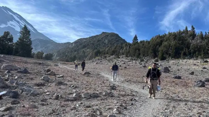 Three Roseville hikers make their way down Mount Shasta after rescuers reached them Monday in Mud Creek Canyon. The hikers became stranded after relying heavily on Google’s Gemini AI to plan their trip, according to the Siskiyou County Sheriff’s Office.