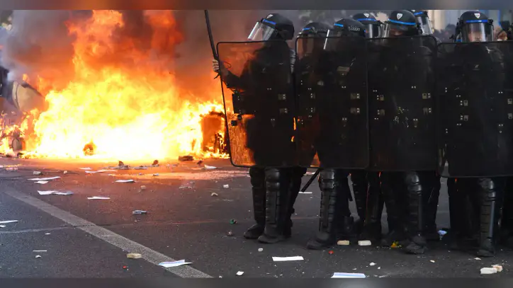 Riot police clash with demonstrators on biggest day of French student protests - as it happened