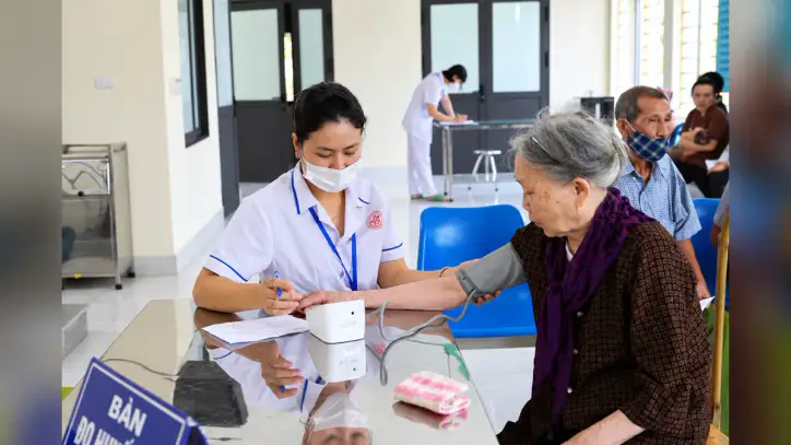 Nurse Recording an Elderly Patient’s Blood Pressure