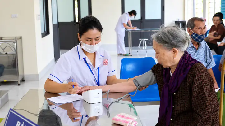 Nurse Recording an Elderly Patient’s Blood Pressure