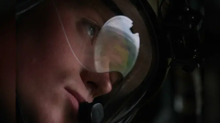 A soldier scans the landscape as he flies in a support helicopter to accompany Marine One, carrying U.S. President Donald Trump, from Shannon enroute to Doonbeg, County Clare, Ireland, Saturday, Sept. 12, 2026. (AP Photo/Julia Demaree Nikhinson)