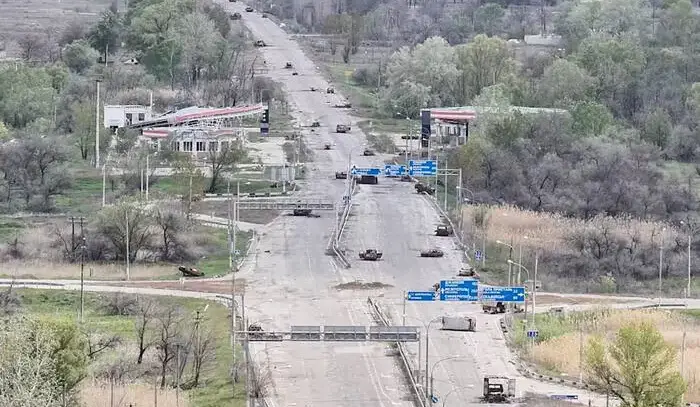 Desperate civilians risk their lives along mined roads to escape from a Russian-held city